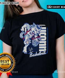 UConn Huskies basketball mascot performing a dunk while wearing a ladies tee, showcasing school spirit and excitement.