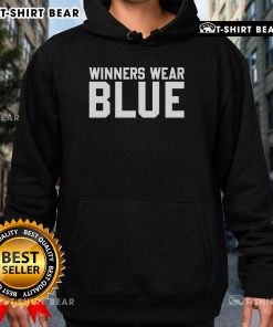 Top winners wearing blue hoodies celebrating their achievements at an award ceremony.