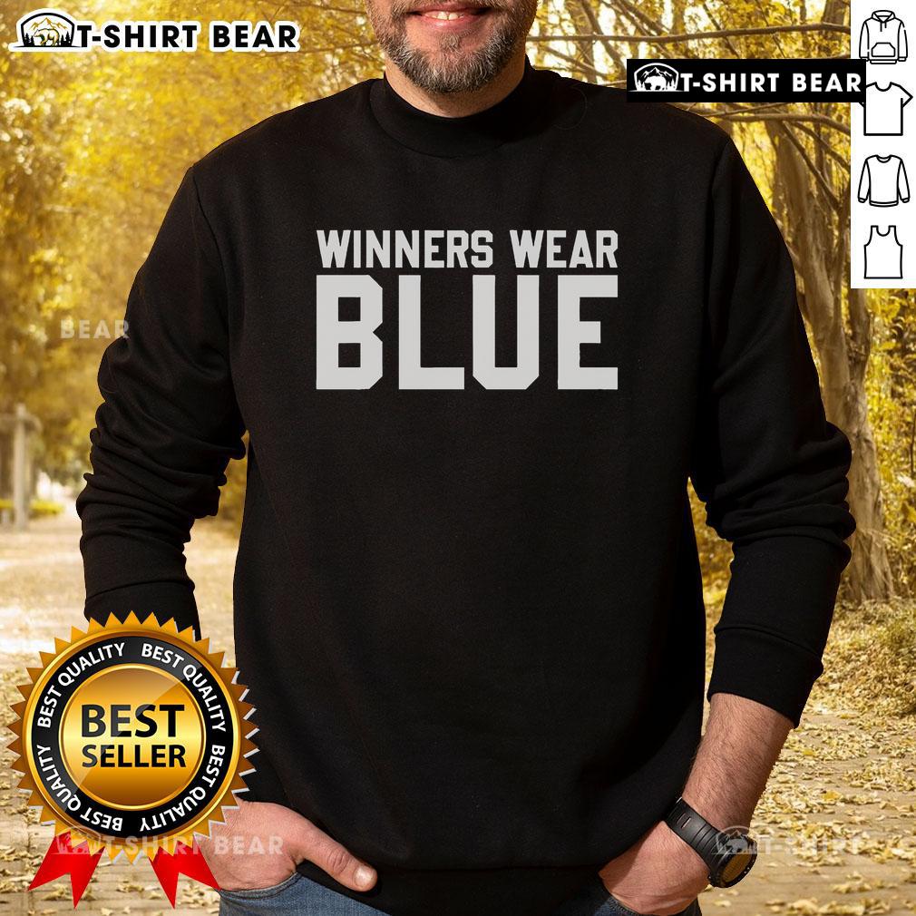 Top Winners Wear Blue Sweatshirt Top winners wearing blue sweatshirt celebrate their achievements at an awards ceremony, showcasing camaraderie and success.