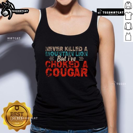 Funny Never Killed A Mountain Lion But I've Choked A Cougar Tank Top featuring a humorous graphic design and bold text.