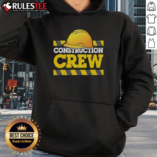 Awesome construction crew wearing construction hats and hoodies at a job site, showcasing teamwork and safety.
