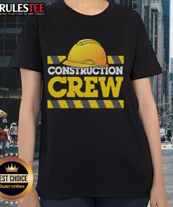 Awesome construction crew wearing construction hats and ladies' tees, showcasing teamwork and dedication on site.