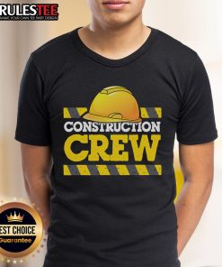 Awesome construction crew wearing construction hats and worker t-shirts on a job site, showcasing teamwork and safety.