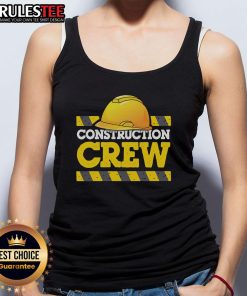 Awesome construction crew wearing hats and tank tops at a job site, showcasing teamwork and dedication in construction work.