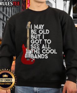 Vintage concert sweatshirt featuring guitar design, celebrating music nostalgia for old-school band fans.