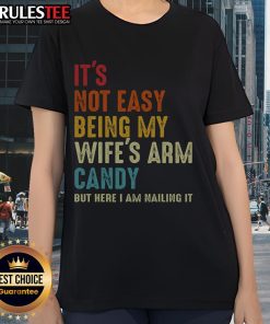 Funny ladies tee: 'It's Not Easy Being My Wife's Arm Candy' showcasing a stylish design perfect for casual wear.