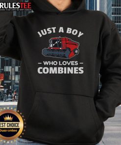 A boy wearing a red combine harvester hoodie, showcasing his love for farming and combine harvesters.