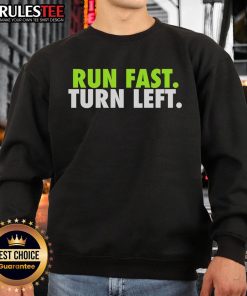 Track runner in a motivational fitness sweatshirt, showcasing speed and determination on a left turn during a race.