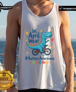 Cute autism awareness dinosaur wearing a tank top, promoting acceptance and understanding in April for Autism Awareness Month.