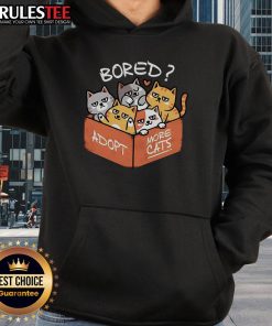 Cute bored cat wearing a hoodie with the phrase Adopt More Cats for pet lovers and adoption advocates.