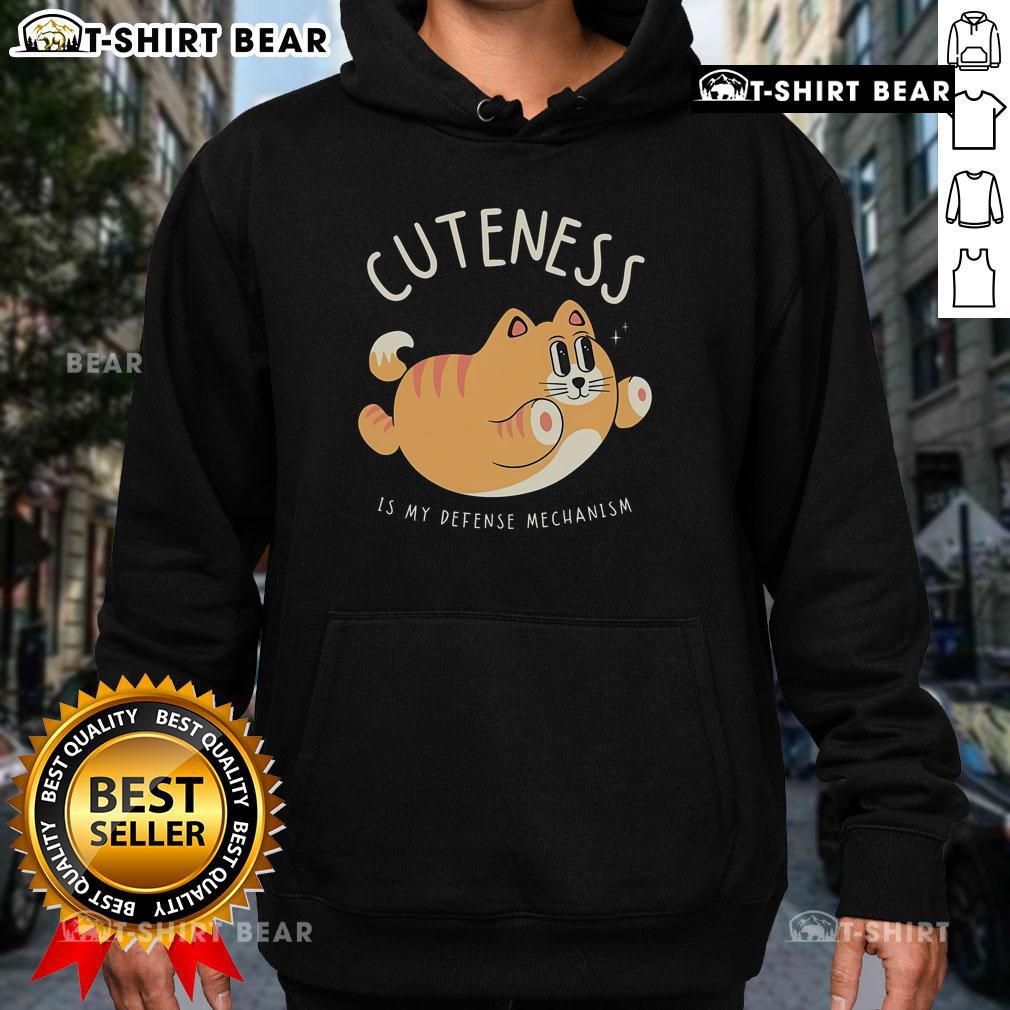 Cute Cat Cuteness Is My Defense Mechanism Hoodie Alt Text: Cute Cat Cuteness Is My Defense Mechanism Hoodie featuring an adorable cat design for cat lovers.