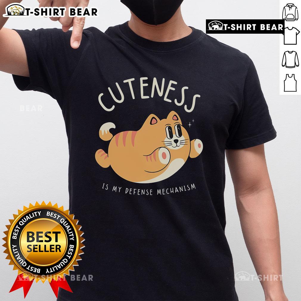 Cute Cat Cuteness Is My Defense Mechanism T Shirt Alt Text: Cute Cat Cuteness Is My Defense Mechanism T-Shirt featuring an adorable cat graphic in vibrant colors.