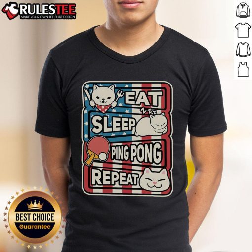Cute cat on a patriotic T-shirt with 'Eat Sleep Ping Pong Repeat' slogan, perfect for table tennis lovers.