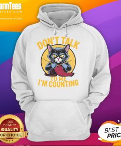 Cute cat in a cozy hoodie with Dont Talk to Me, Im Counting knitting design, perfect for knit lovers and cat enthusiasts.