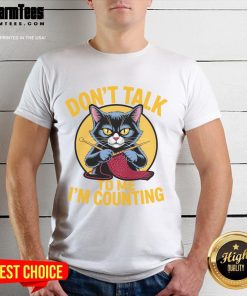 Alt Text: Cute cat graphic on a knitting-themed t-shirt saying Don't talk to me, I'm counting for knitting lovers.