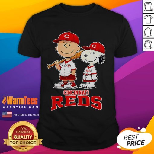 Cute Cincinnati Reds Charlie Brown and Snoopy baseball cartoon fan t-shirt featuring playful graphics and vibrant colors.