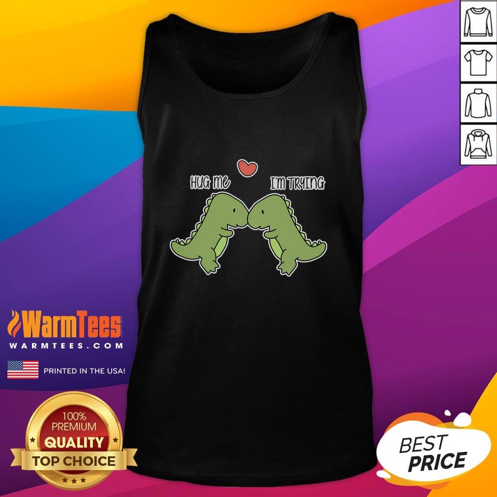 Cute Dinosaur Hug Me I'M Trying Funny Tank Top Cute dinosaur graphic on a funny tank top with the phrase Hug Me, I'm Trying perfect for casual wear and dino lovers.