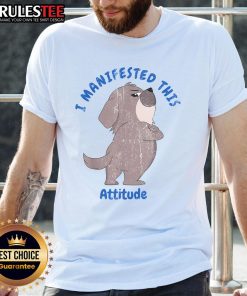 Alt Text: Cute dog wearing a I Manifested This Attitude T-shirt, showcasing playful personality and stylish pet fashion.
