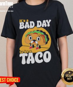 Alt Text: Cute 'It's A Bad Day To Be A Taco' ladies tee showcasing fun taco-themed graphic design for casual wear.