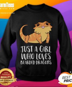 Alt Text: Cute girl wearing a sweatshirt that says Just a Girl Who Loves Bearded Dragons with a lizard in her hands.