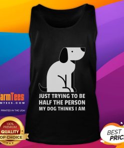 Person in tank top smiling with their dog, embodying the love and joy of being half the person their dog thinks they are.