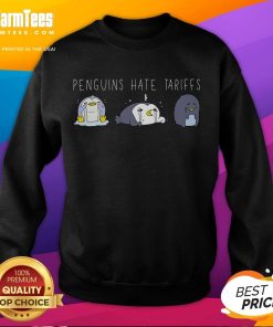 Adorable penguins on a 'Make Fish Cheap Again' sweatshirt, highlighting their playful stance against tariffs.
