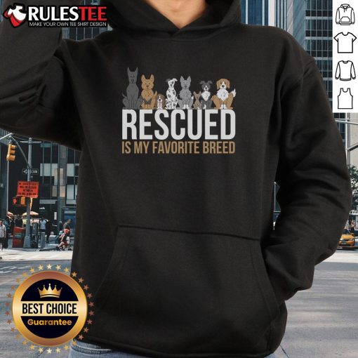 Alt Text: Cute rescued dog wearing a hoodie with 'Rescued is my favorite breed' slogan, showcasing love for animal adoption.