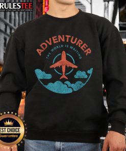 Alt Text: Funny adventurer sweatshirt featuring the phrase The World Is Waiting For Travelers with a plane graphic.