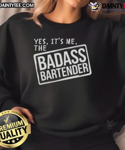 Funny badass bartender in a pub wearing a humorous sweatshirt, showcasing the fun side of bar ownership.