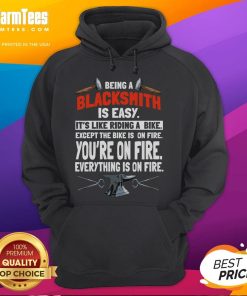 Funny hoodie design: 'Being a Blacksmith is Easy - It's Like Riding a Bike, Except Everything is on Fire.'