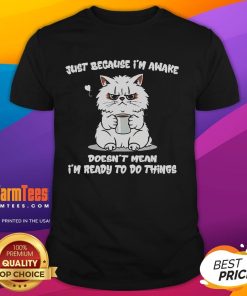 Funny cat coffee t-shirt with the phrase 'Just Because I'm Awake Doesn't Mean I'm Ready To Do Anything' design.