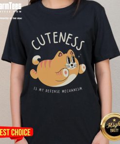 Funny cat graphic tee with the phrase 'Cuteness Is My Defense Mechanism' perfect for cat lovers and humor enthusiasts.