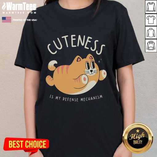 Funny cat graphic tee with the phrase 'Cuteness Is My Defense Mechanism' perfect for cat lovers and humor enthusiasts.