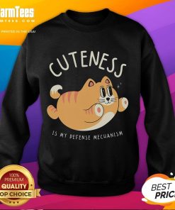 Funny cat sweatshirt with 'Cuteness Is My Defense Mechanism' design, perfect for cat lovers and humor enthusiasts.