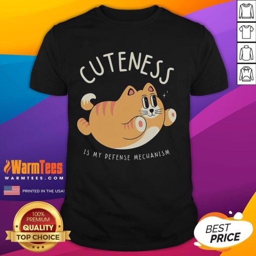 Funny Cat Cuteness Is My Defense Mechanism T-Shirt featuring a playful cat design, perfect for cat lovers and humor enthusiasts.