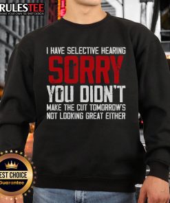 Funny cat with selective hearing wearing a 'You Didn't Make the Cut' sweatshirt, showcasing a humorous expression.