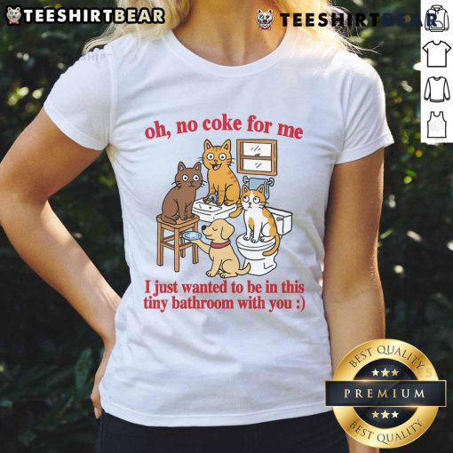 Funny cats in a tiny bathroom, playfully ignoring Coke, wearing humorous expressions on a ladies' tee shirt.