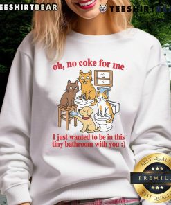 Alt Text: Funny cats in a tiny bathroom wearing a sweatshirt that says 'Oh No Coke for Me' showcasing adorable feline antics.