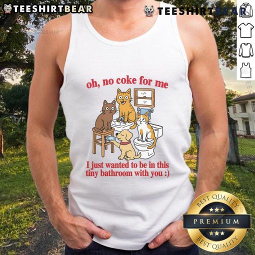Funny cat in a tiny bathroom wearing a tank top, playfully avoiding coke and seeking companionship.