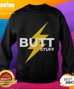 Colorful scene from a gay pride parade featuring a humorous 'Butt Stuff Power Bottom' sweatshirt worn by a joyful participant.