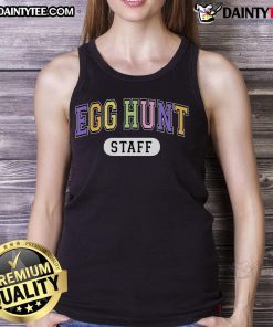 Staff in funny tank tops enjoying a varsity Easter event during a lively egg hunt.