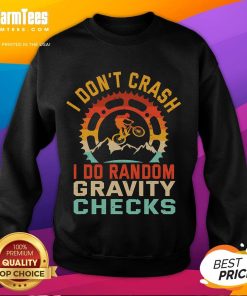 Funny sweatshirt with 'I Don't Crash, I Do Random Gravity Checks' design for mountain biking enthusiasts.