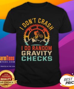Alt Text: Funny I Don't Crash, I Do Random Gravity Checks mountain biking t-shirt design with humorous graphics for cyclists.