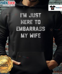 Funny workout hoodie saying 'I'm just here to embarrass my wife/husband/dad' perfect for gym humor and gifts.