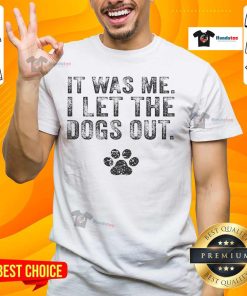 Funny 'It Was Me I Let The Dogs Out' distressed t-shirt for dog lovers, featuring playful text and a casual design.