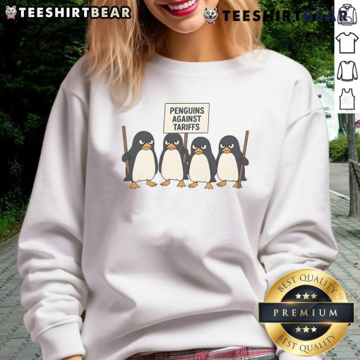 Funny penguins protesting against tariffs on a colorful sweatshirt design featuring cartoon penguins.