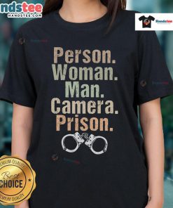 Funny woman and man posing with a camera in prison-themed ladies tee, showcasing humor and style.