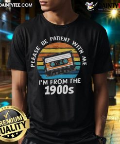 Funny vintage sunset T-shirt featuring 'Please Be Patient With Me, I'm From The 1900s' VHS tape design.