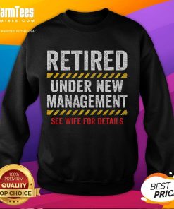 Alt Text: Funny retired husband wearing a retirement sweatshirt at his retirement party, smiling and enjoying the celebration.