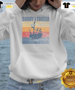 Funny bagpipe player wearing a hoodie with Sorry, I Tooted graphic, showcasing humor and music culture.